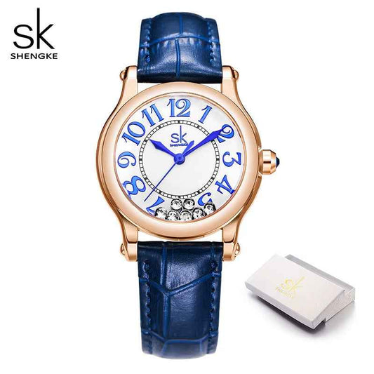 Blue watch with rose gold case and white face on a white background, featuring Shengke brand.