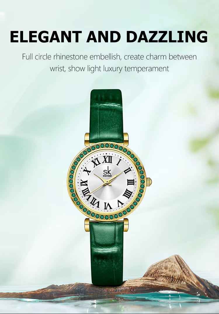 Green wristwatch with rhinestone embellishments on a blurred natural background