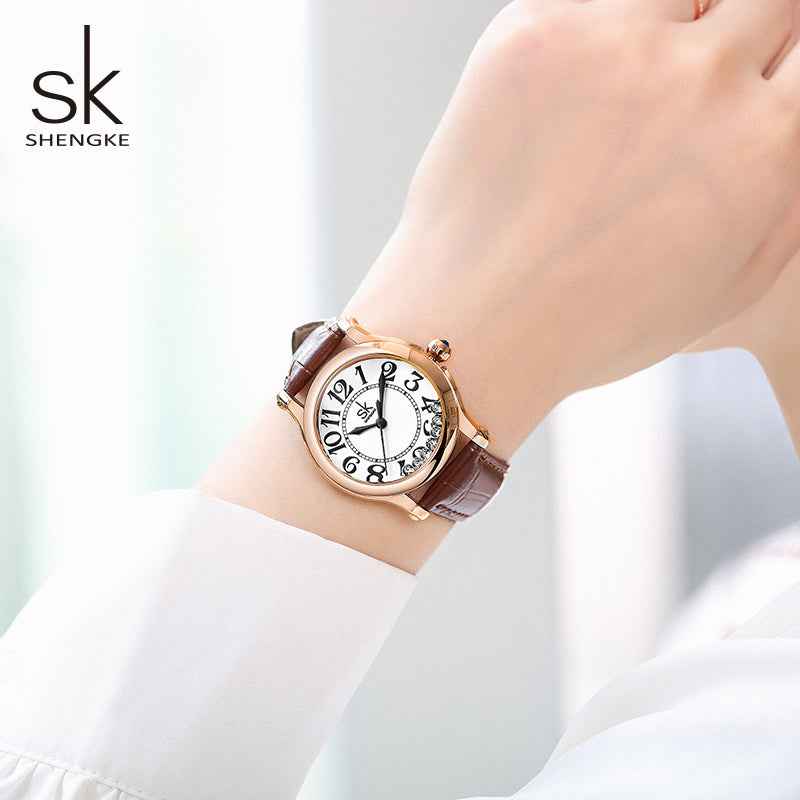Shengke watch on a wrist with a blurred background