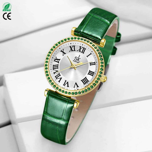Green wristwatch with gold accents on a white background