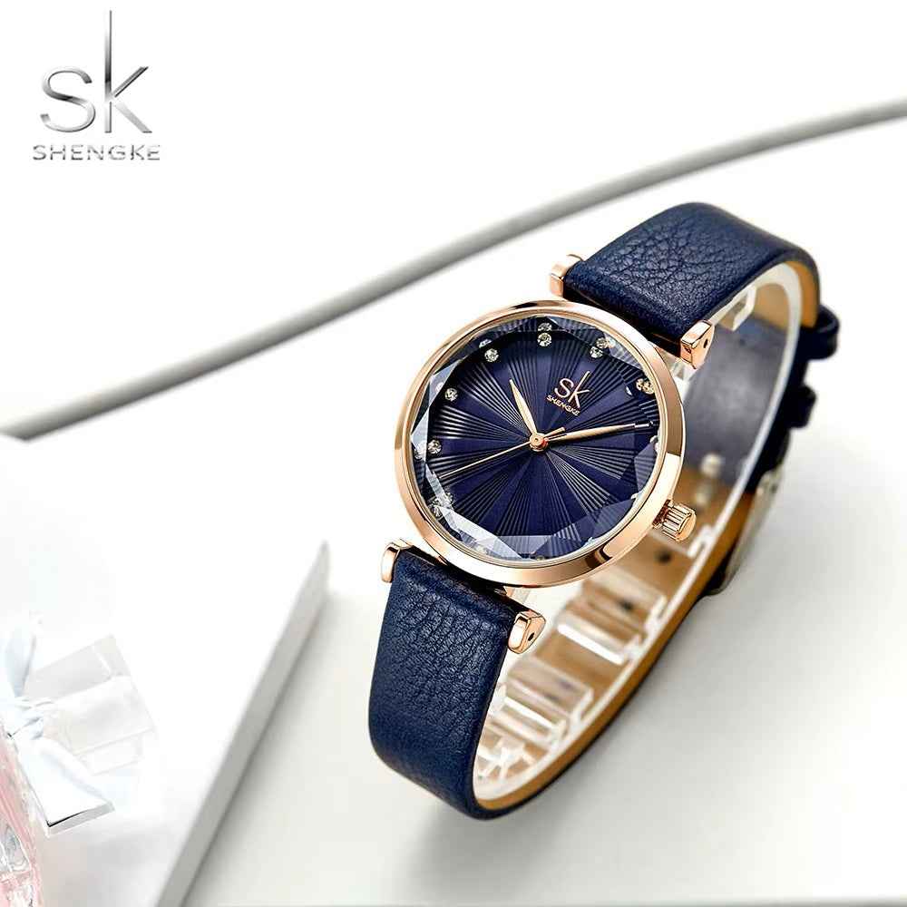 Black watch with rose gold accents on a white surface, featuring the brand 'Shengke'.