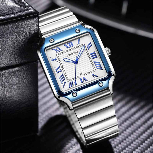 Silver watch with blue accents on a dark textured background