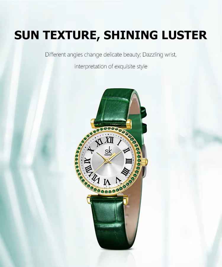 Green wristwatch with gold accents on a white background