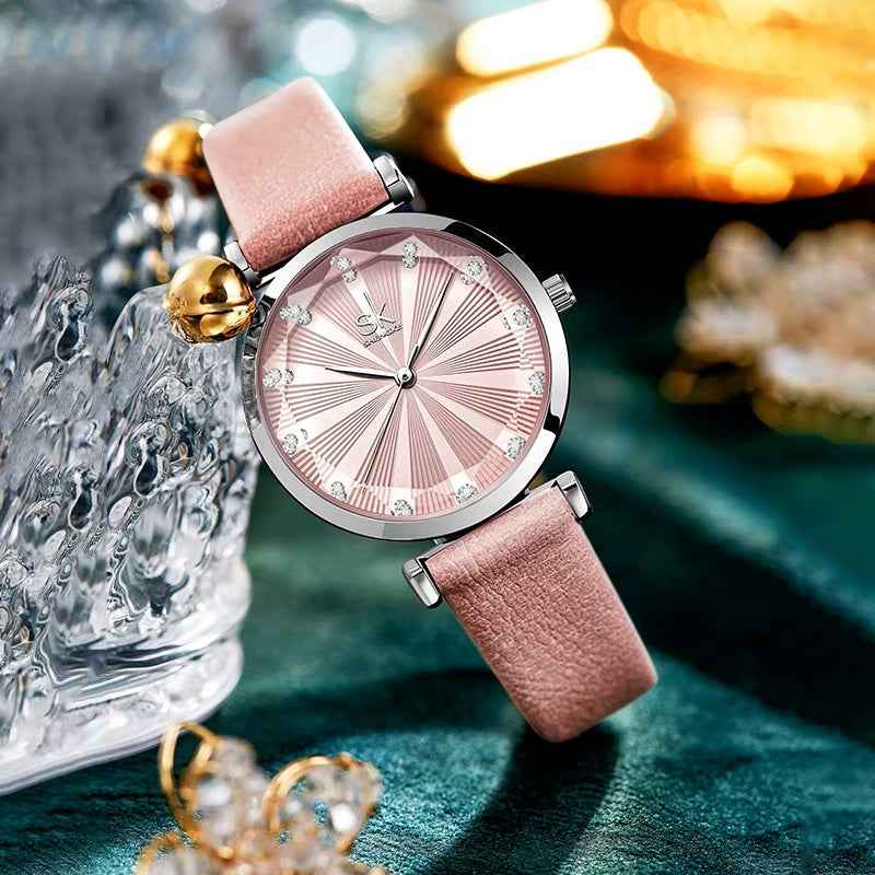 Pink wristwatch with decorative background