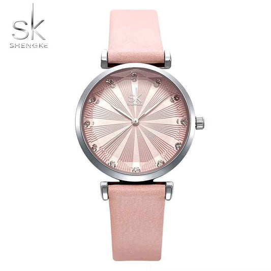 Shengke watch with pink strap and silver gold dial on a white background